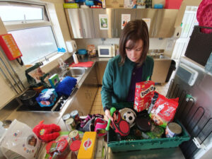 Team member organising pet foodbank donations